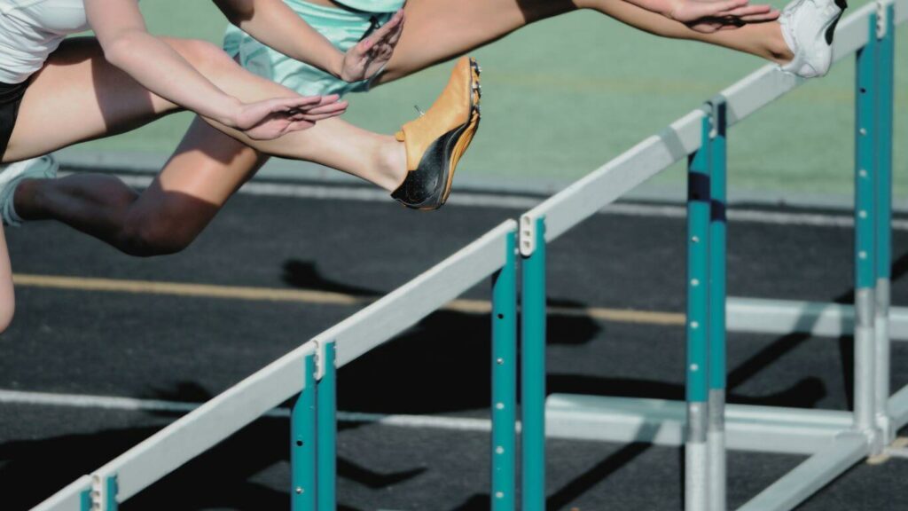 Photo of people overcoming barriers, i.e. hurdles